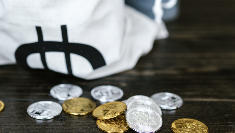 Physical crypto coins scattered on the table