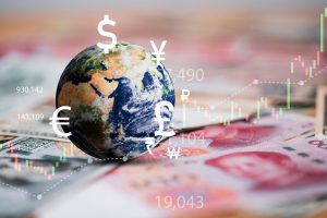 Globe placed n different currenciy notes with virtual  currency sign floating around it including dollar euro yen yuan pound sterling representing the global economy